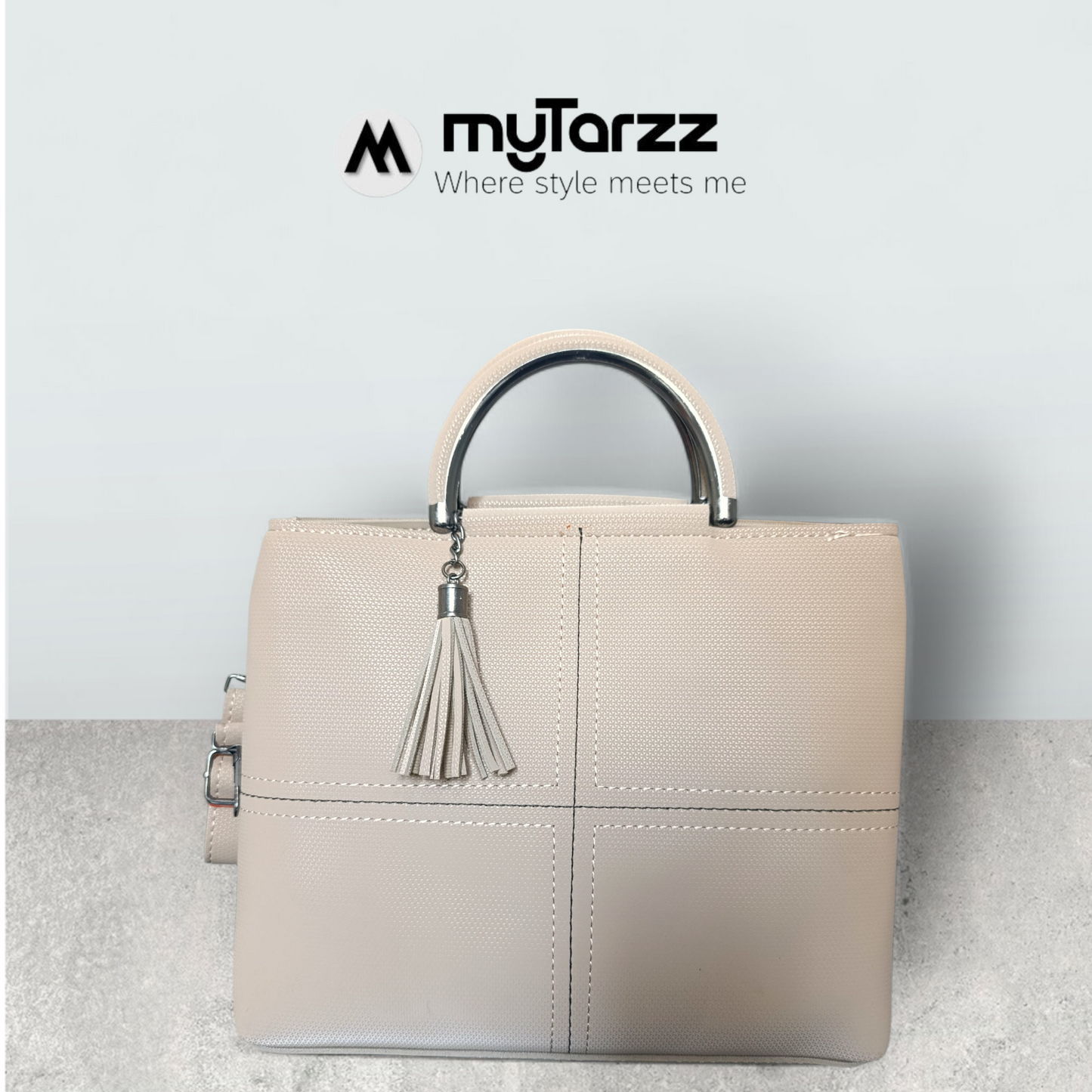 Chic Nude Perforated Tote with Tassel Charm